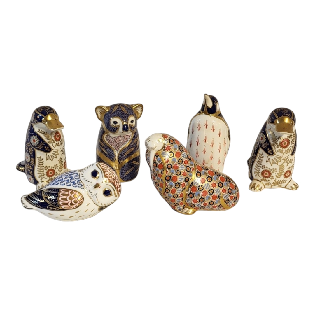 ROYAL CROWN DERBY, A PAIR OF BONE CHINA PAPERWEIGHT MODELS OF PLATYPUS Figure of an Emperor penguin,