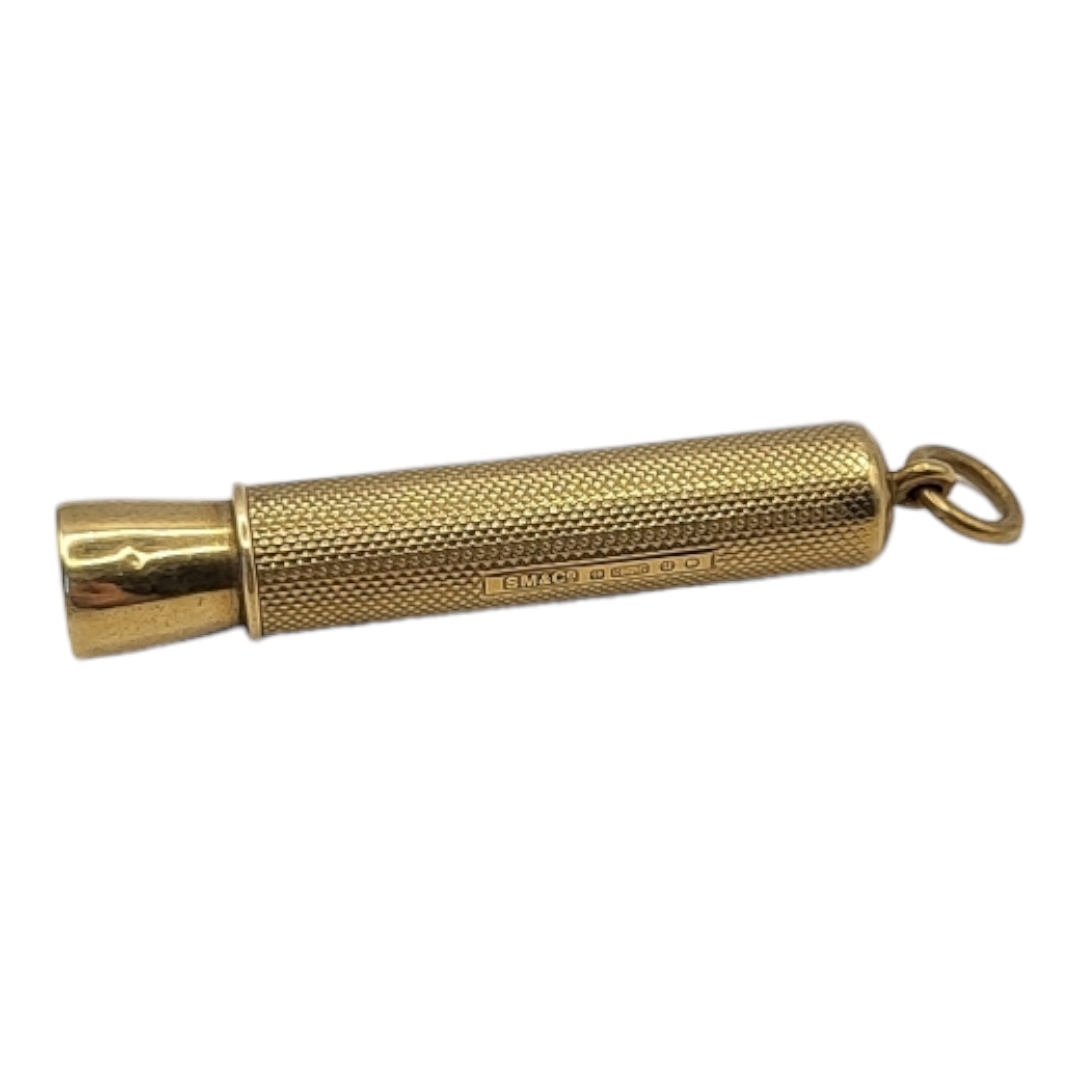 SAMPSON AND MORDAN, A VINTAGE 9CT GOLD CIGAR PUNCH Having engine turned decoration. (approx 5.5cm)