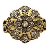 AN 18CT DIAMOND DAISY CLUSTER RING Set with old brilliant, rose and transitional cut diamonds, along