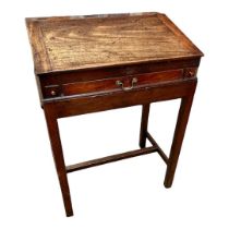 A GEORGIAN MAHOGANY CLERKS DESK ON STAND The rise and fall removable top having a single drawer