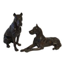 AN EARLY 20TH CENTURY CONTINENTAL PATINATED BRONZE MODEL OF A DOBERMAN PINCHER DOG In recumbent