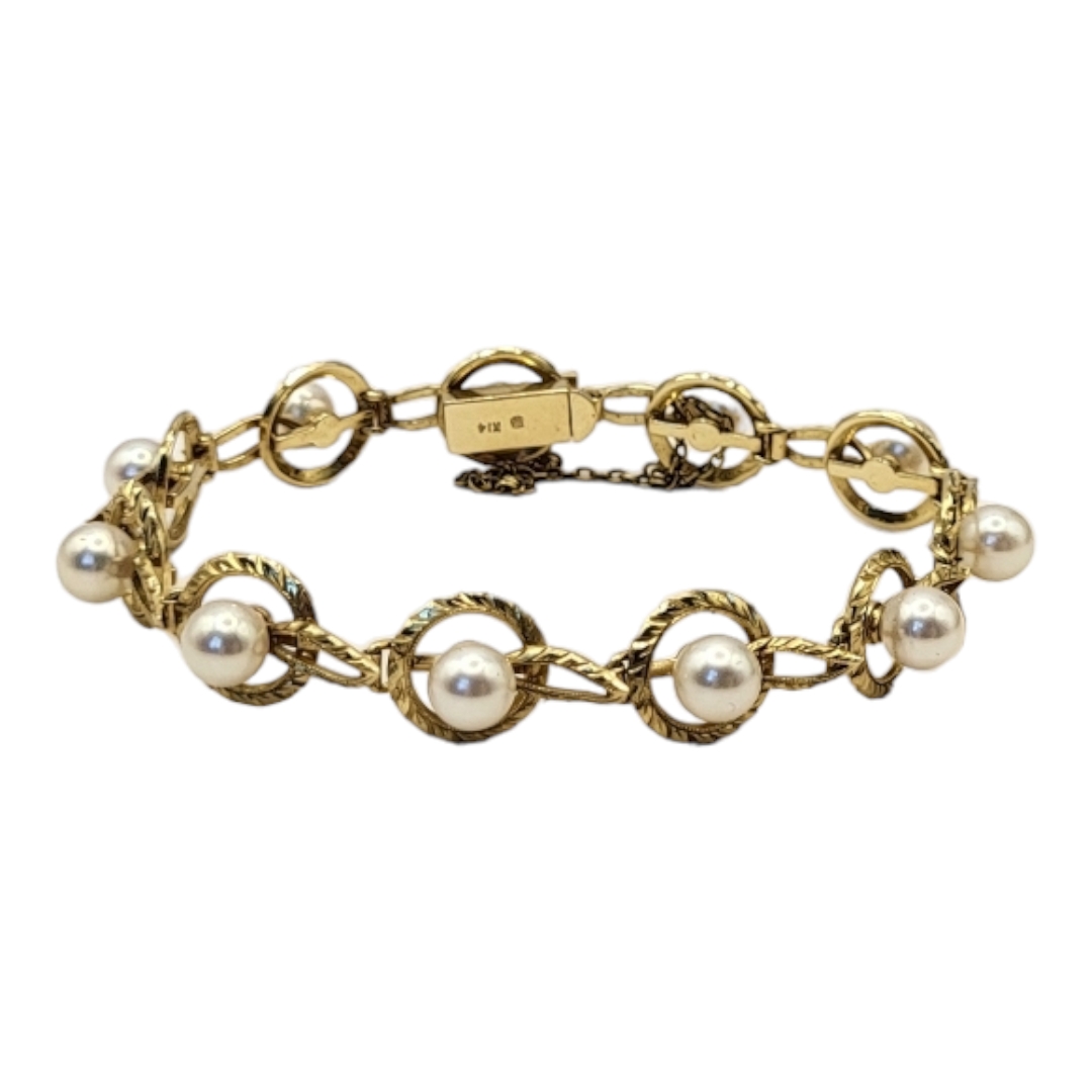 MIKIMOTO, A VINTAGE 14CT GOLD AND PEAL BRACELET Having a single row of pearls within a pierced - Image 6 of 7