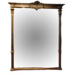 A LARGE VICTORIAN DESIGN GILT FRAMED MIRROR With fleur-de-lis crest flanked by columns. (w 142cm x