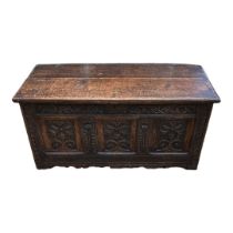 AN 18TH CENTURY OAK COFFER With three carved panelled front. (117cm x 52cm x 56cm)