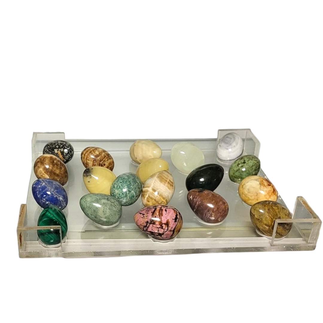 A COLLECTION OF NINE VARIOUS MARBLE AND STONEWARE ORNAMENTAL EGGS. (each approx length 7cm)