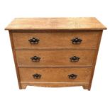 AN ARTS & CRAFTS PERIOD OAK CHEST OF THREE LONG DRAWERS. (96.5cm x 50cm x 75.5cm) Condition: good