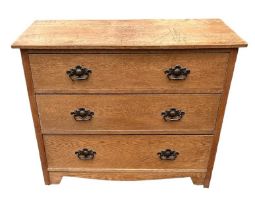 AN ARTS & CRAFTS PERIOD OAK CHEST OF THREE LONG DRAWERS. (96.5cm x 50cm x 75.5cm) Condition: good
