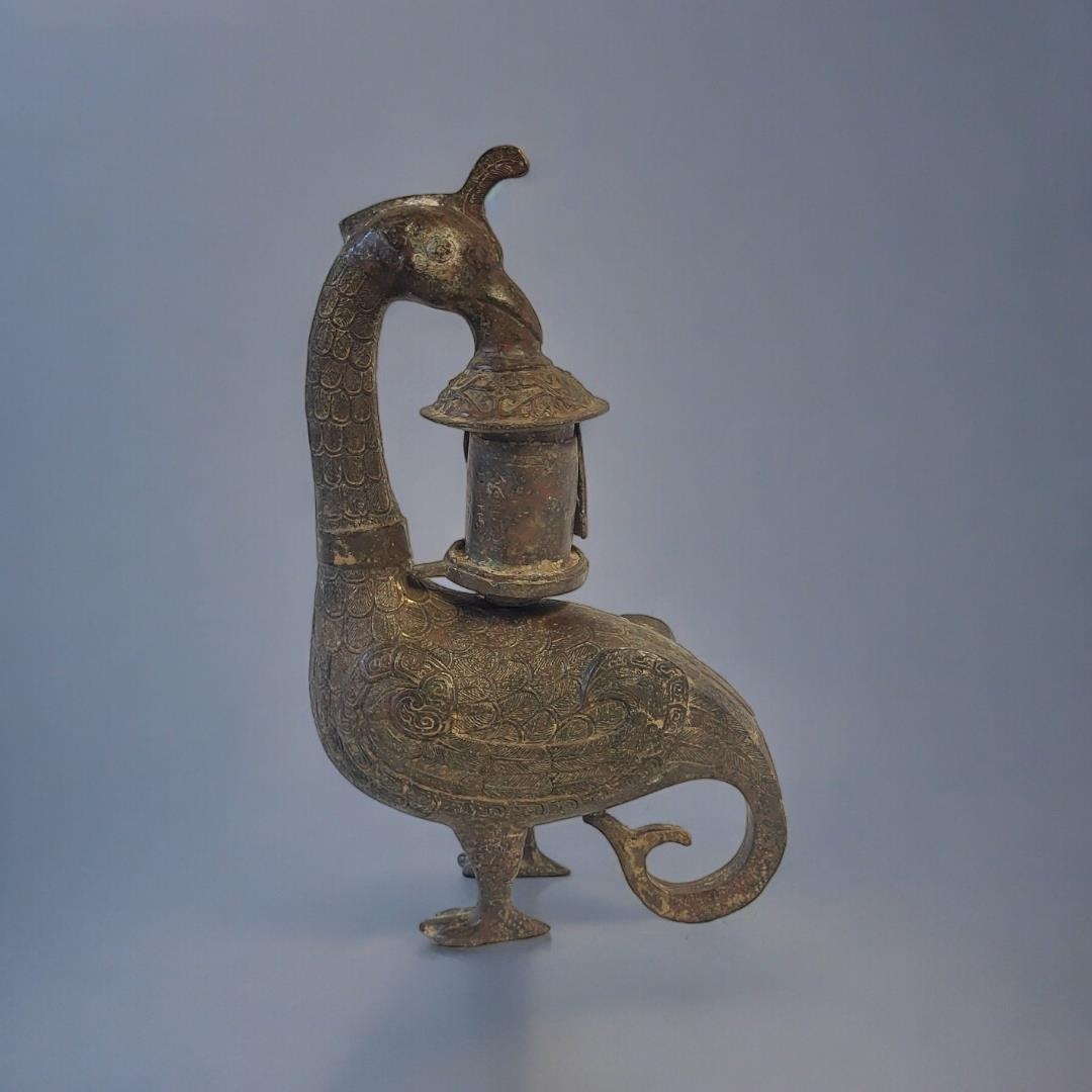 A LARGE GILT PLANISHED BRONZE CHINESE INCENSE BURNER Taking the form of a crane with temple and
