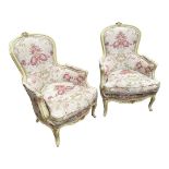 A PAIR OF CONTINENTAL SPOON BACK ARMCHAIRS With cream and green painted frames, in floral fabric