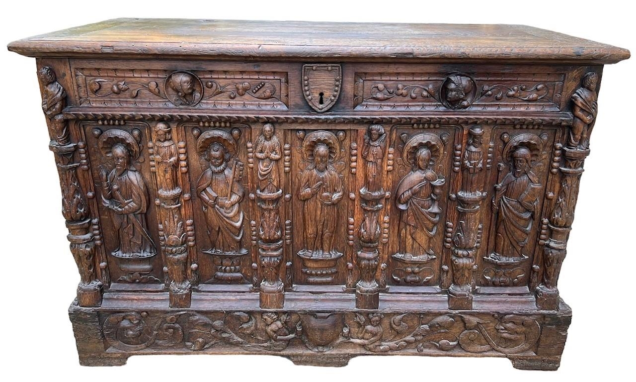 A 16TH CENTURY FRENCH, OAK COFFER with hinged lid above carved freeze decorated with swags and