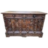 A 16TH CENTURY FRENCH, OAK COFFER with hinged lid above carved freeze decorated with swags and