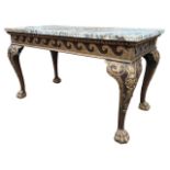 MANNER OF WILLIAM KENT, AN 18TH CENTURY CARVED WALNUT AND PARCEL GILT CENTRE TABLE The coloured