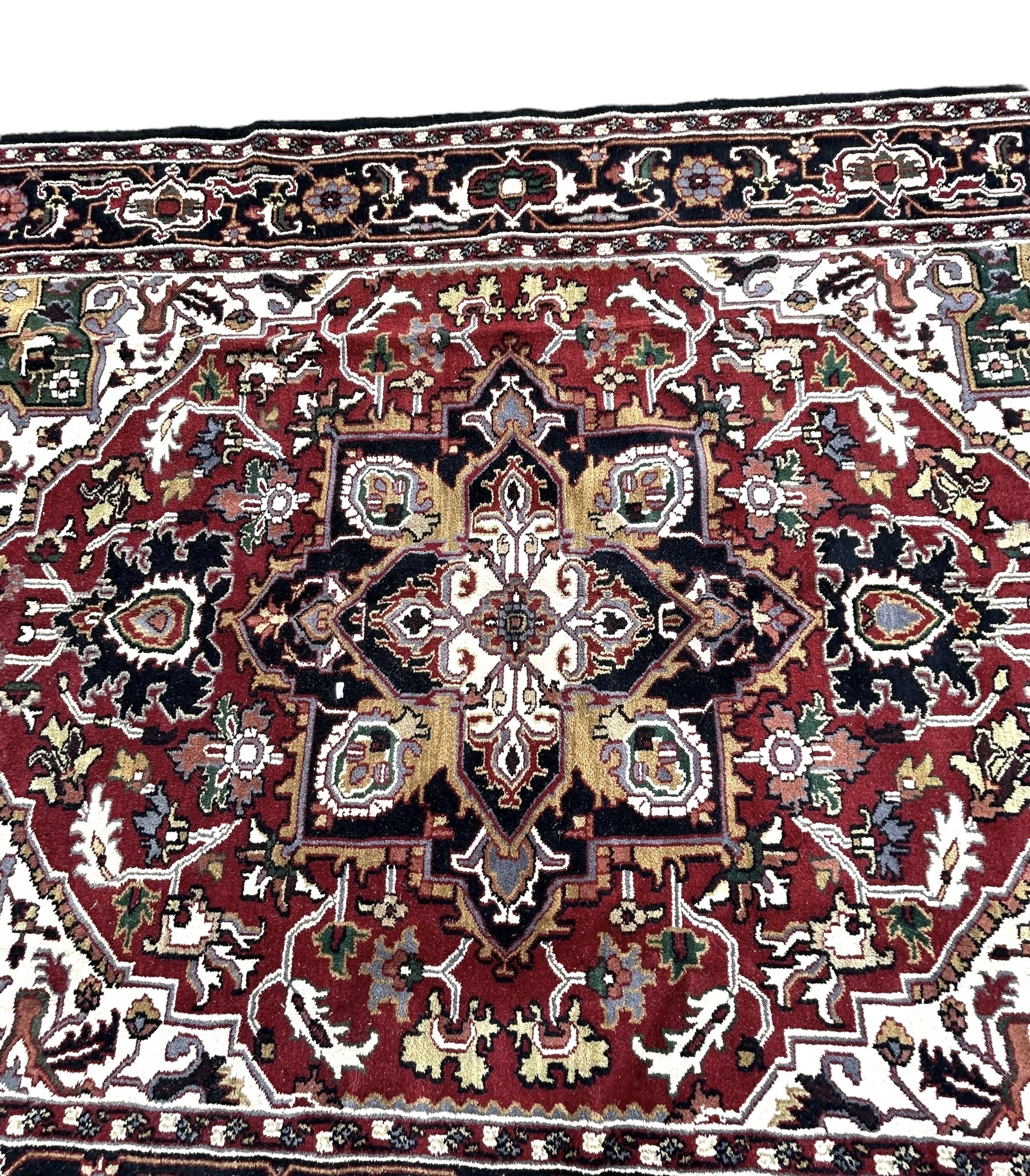 A 20TH CENTURY PERSIAN STYLE HERIZ CARPET Having central floral medallion on red and white ground, - Image 2 of 4