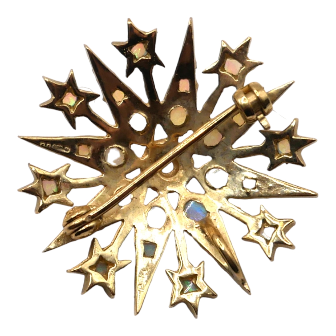 A VINTAGE 9CT GOLD AND OPAL STAR BROOCH Having thirty-three graduated cabochon cut opals, in star - Image 2 of 2