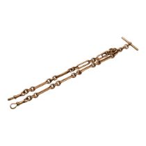 A LATE VICTORIAN/EARLY EDWARDIAN 9CT ROSE GOLD DOUBLE ALBERT CHAIN WITH T BAR Having trombone links,