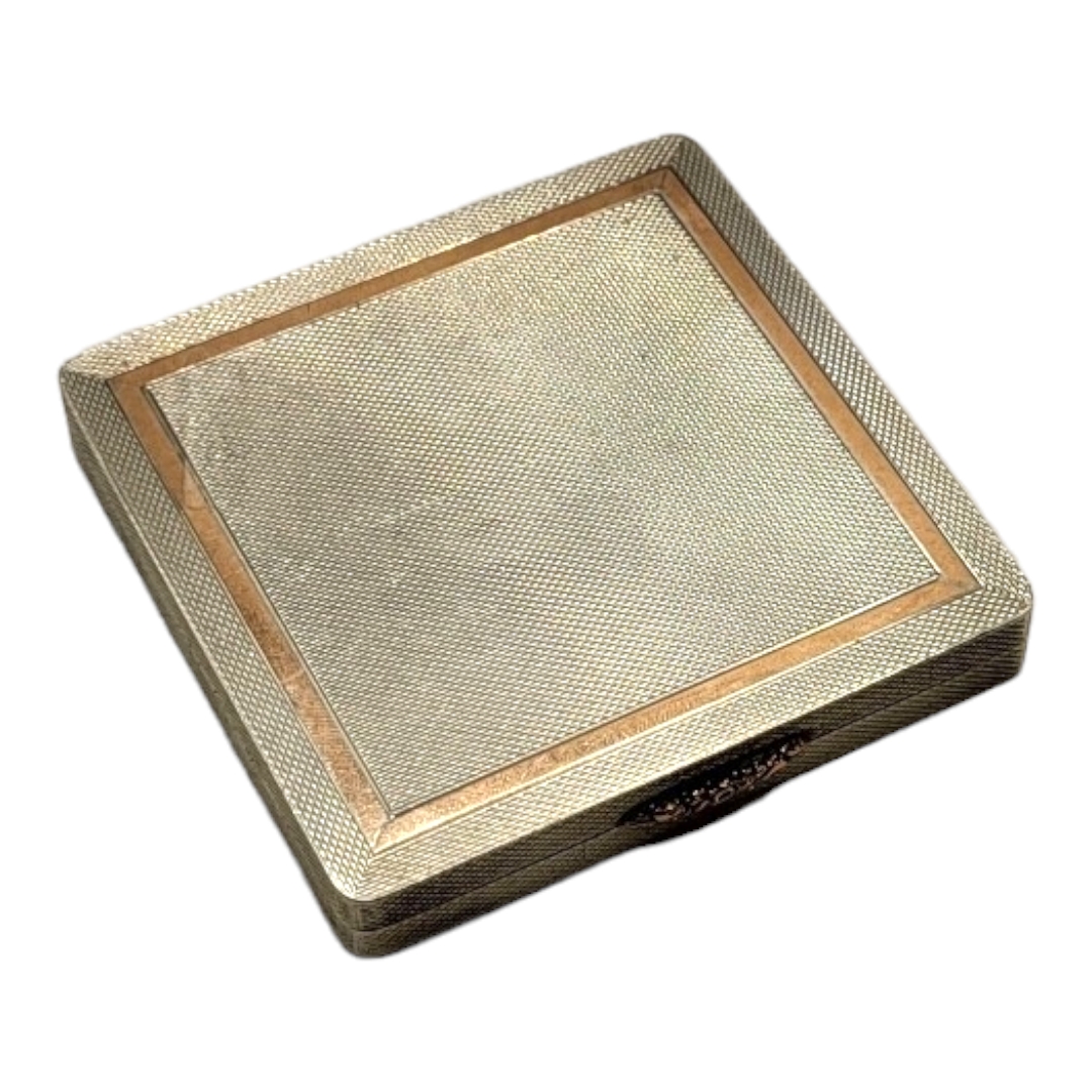 W.H. MANTON LTD, A MID 20TH CENTURY ART DECO STYLE SILVER AND ROSE GOLD MIRRORED COMPACT, HALLMARKED