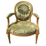 LOUIS DELANOIS, AN 18TH CENTURY FRENCH LOUIS XVI CARVED GILTWOOD ARMCHAIR With oval padded back,