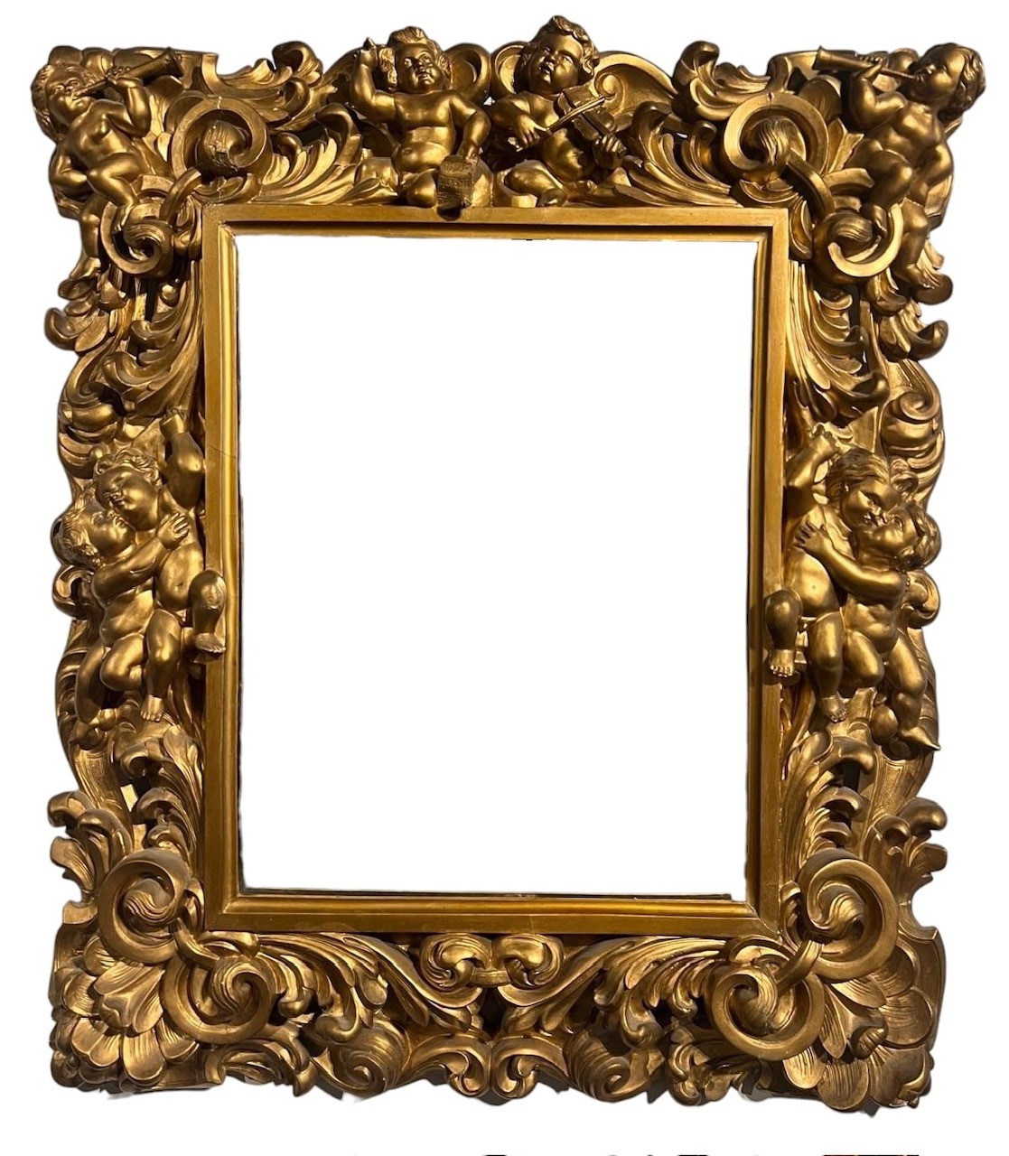 AN 18TH CENTURY ITALIAN FLORENTINE CARVED GILTWOOD MIRROR Decorated with scrolling foliage and