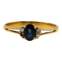 A 14CT YELLOW GOLD, BLUE TOPAZ AND DIAMOND RING The central oval cut blue topaz (approx. 5.5mm x