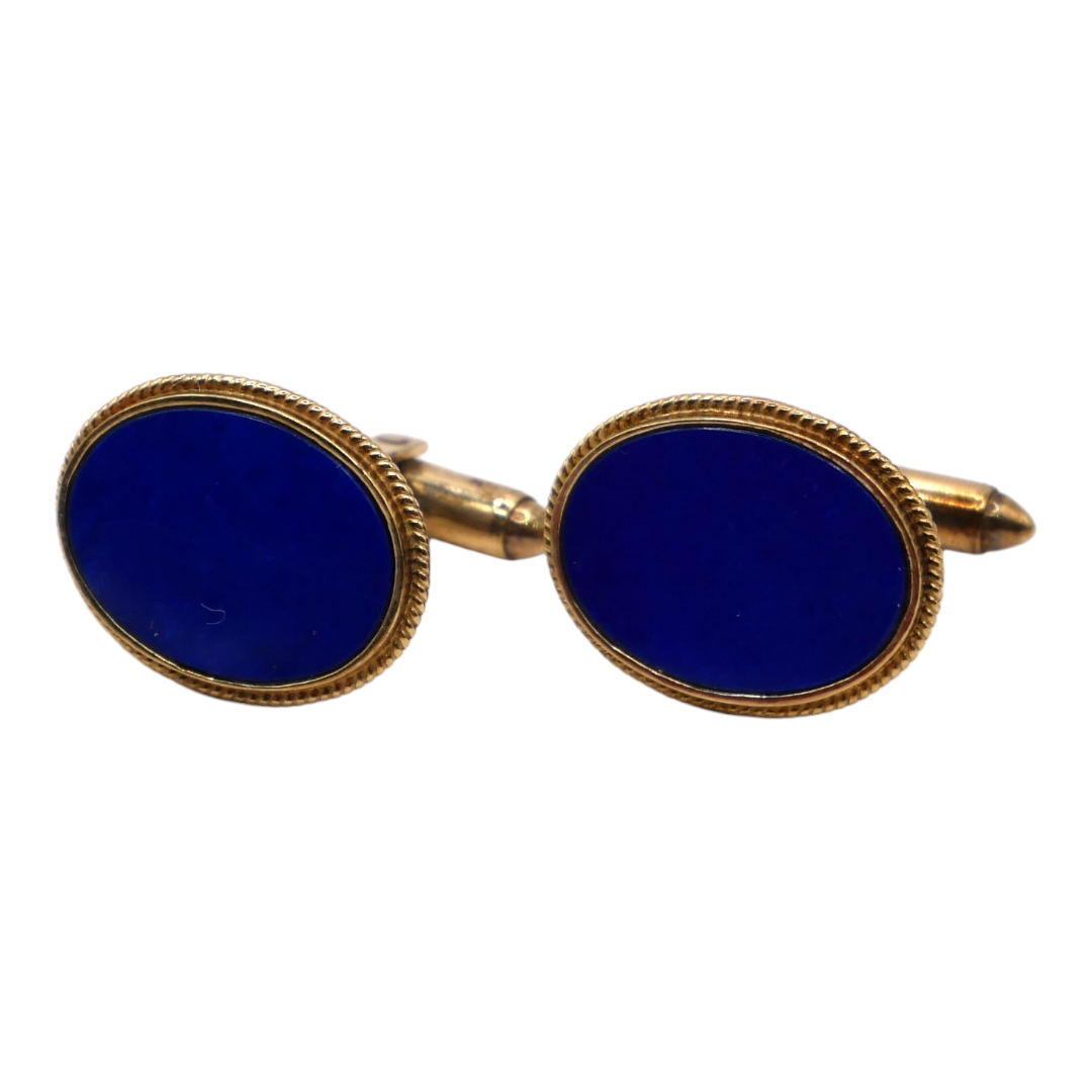 A VINTAGE 14CT GOLD AND LAPIS LAZULI OVAL CUFFLINKS Polished flat cut oval Lapis Lazuli insert, held