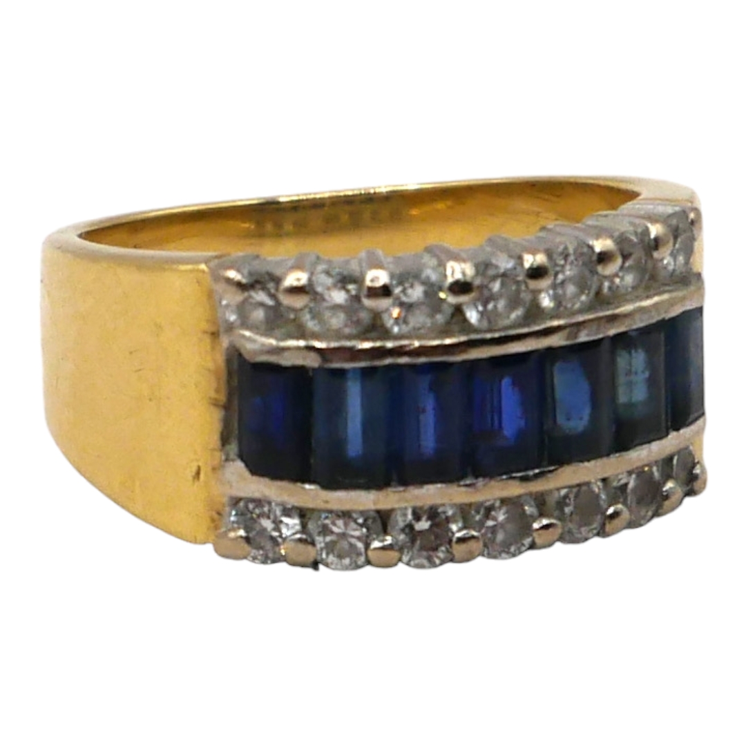 A VINTAGE 18CT GOLD, DIAMOND AND SAPPHIRE RING Consisting of seven baguette cut sapphires (approx.