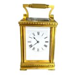 A LARGE 19TH CENTURY FRENCH REPEATING CARRIAGE CLOCK Surmounted by a fluted handle, large bevelled