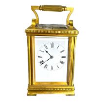 A LARGE 19TH CENTURY FRENCH REPEATING CARRIAGE CLOCK Surmounted by a fluted handle, large bevelled