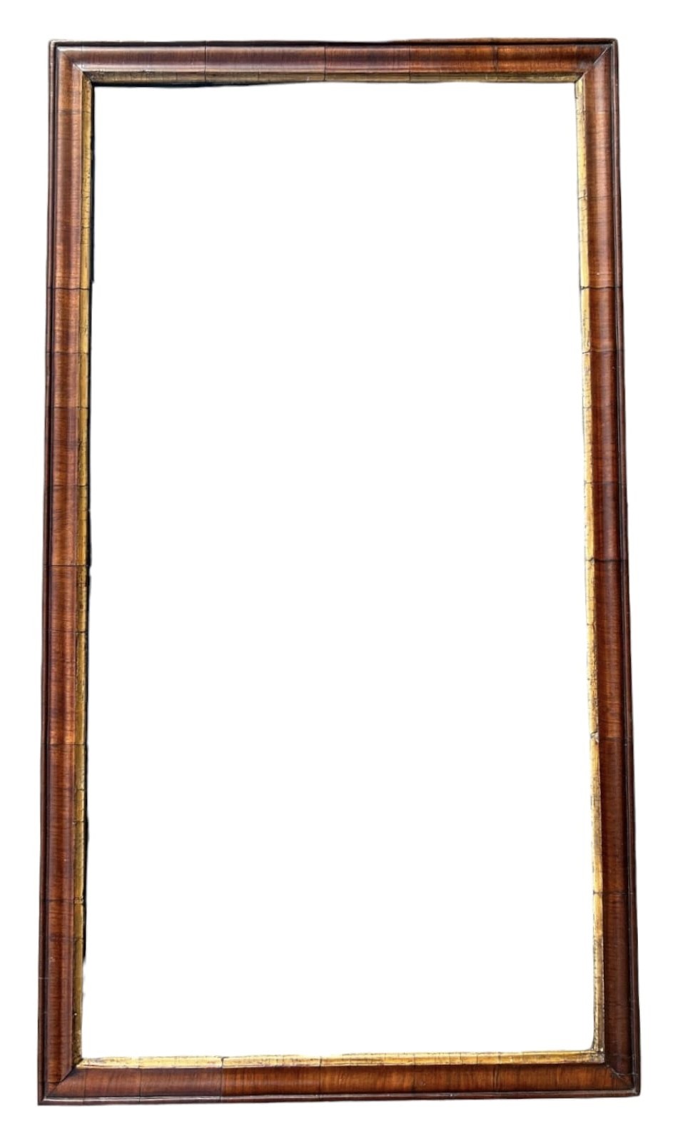 AN 18TH CENTURY WALNUT AND PARCEL GILT PIER MIRROR. (77cm x 42.5cm)