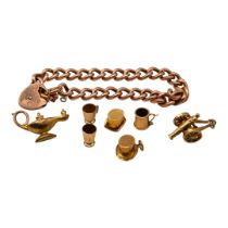 A 9CT ROSE GOLD CURB LINK BRACELET/CHARM BRACELET. TOGETHER WITH SIX 9CT GOLD CHARMS AND SINGULAR