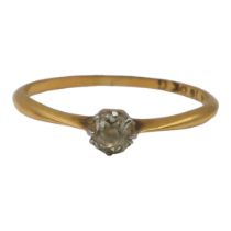 AN 18CT GOLD DIAMOND SOLITAIRE RING Having old European round cut diamond (approx 3mm) in claw set