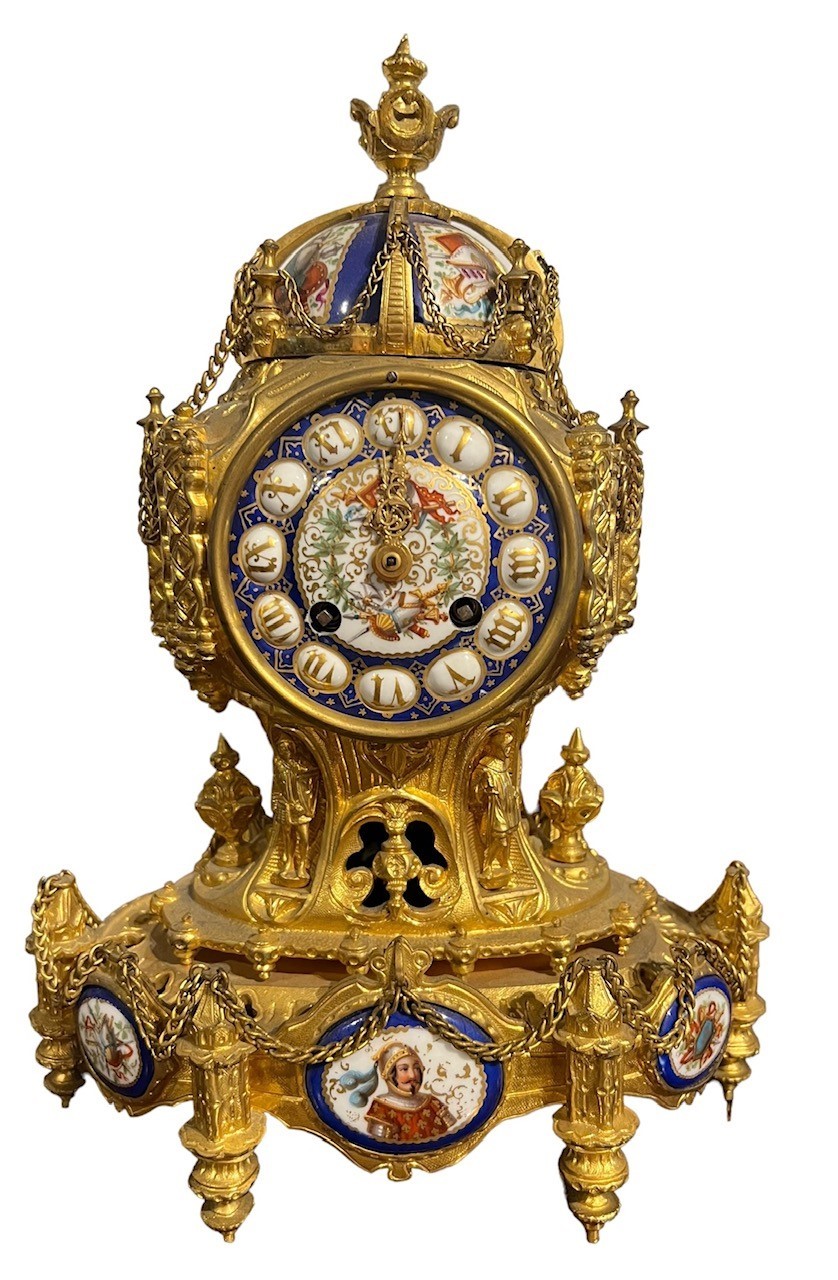 A 19TH CENTURY FRENCH GILT METAL AND PORCELAIN MOUNTED STRIKING MANTEL CLOCK The case modelled
