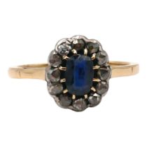 A POLISH 14CT GOLD, DIAMOND AND BLUE TOPAZ CLUSTER RING The central oval cut blue topaz (approx. 6mm