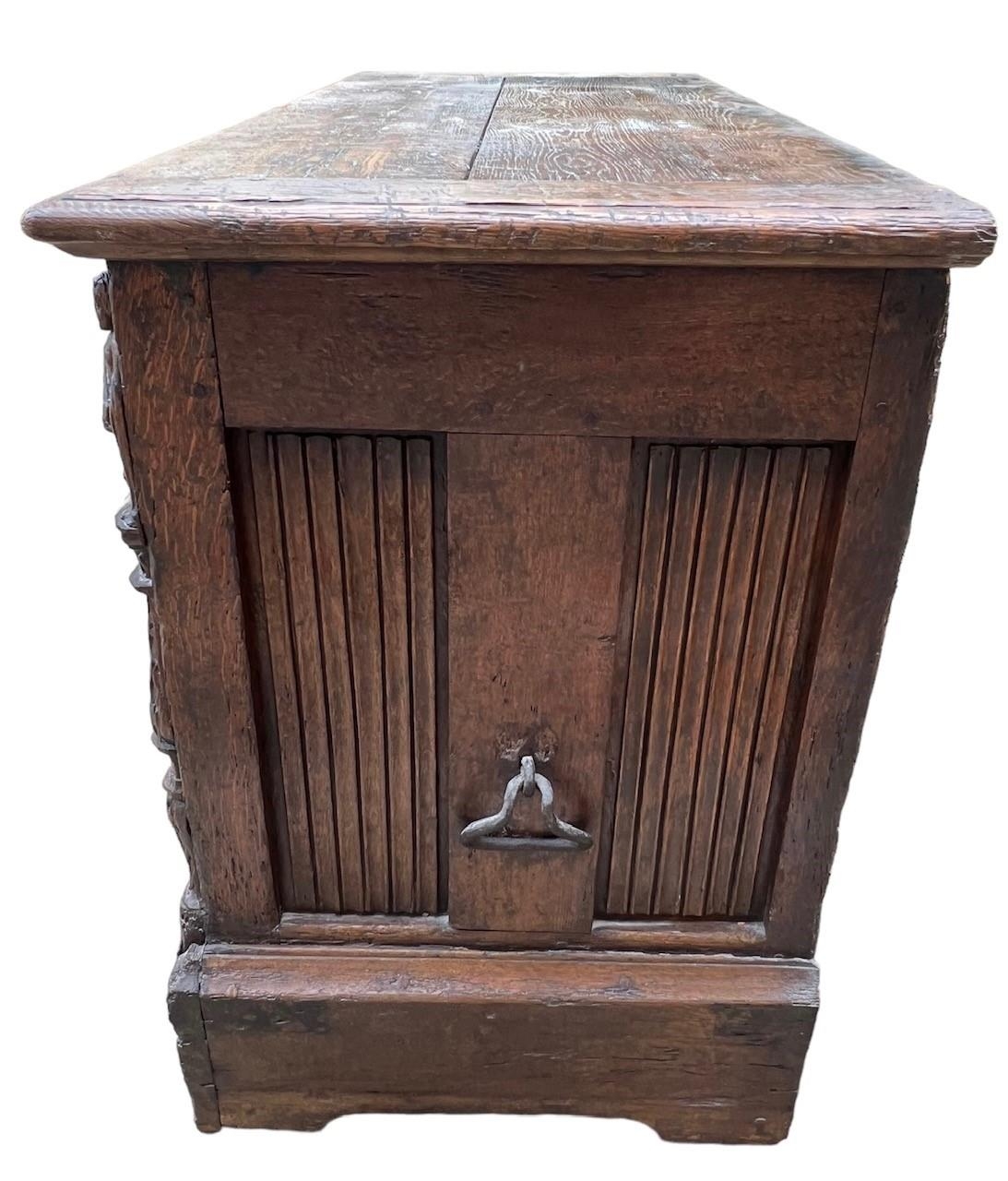 A 16TH CENTURY FRENCH, OAK COFFER with hinged lid above carved freeze decorated with swags and - Image 4 of 13