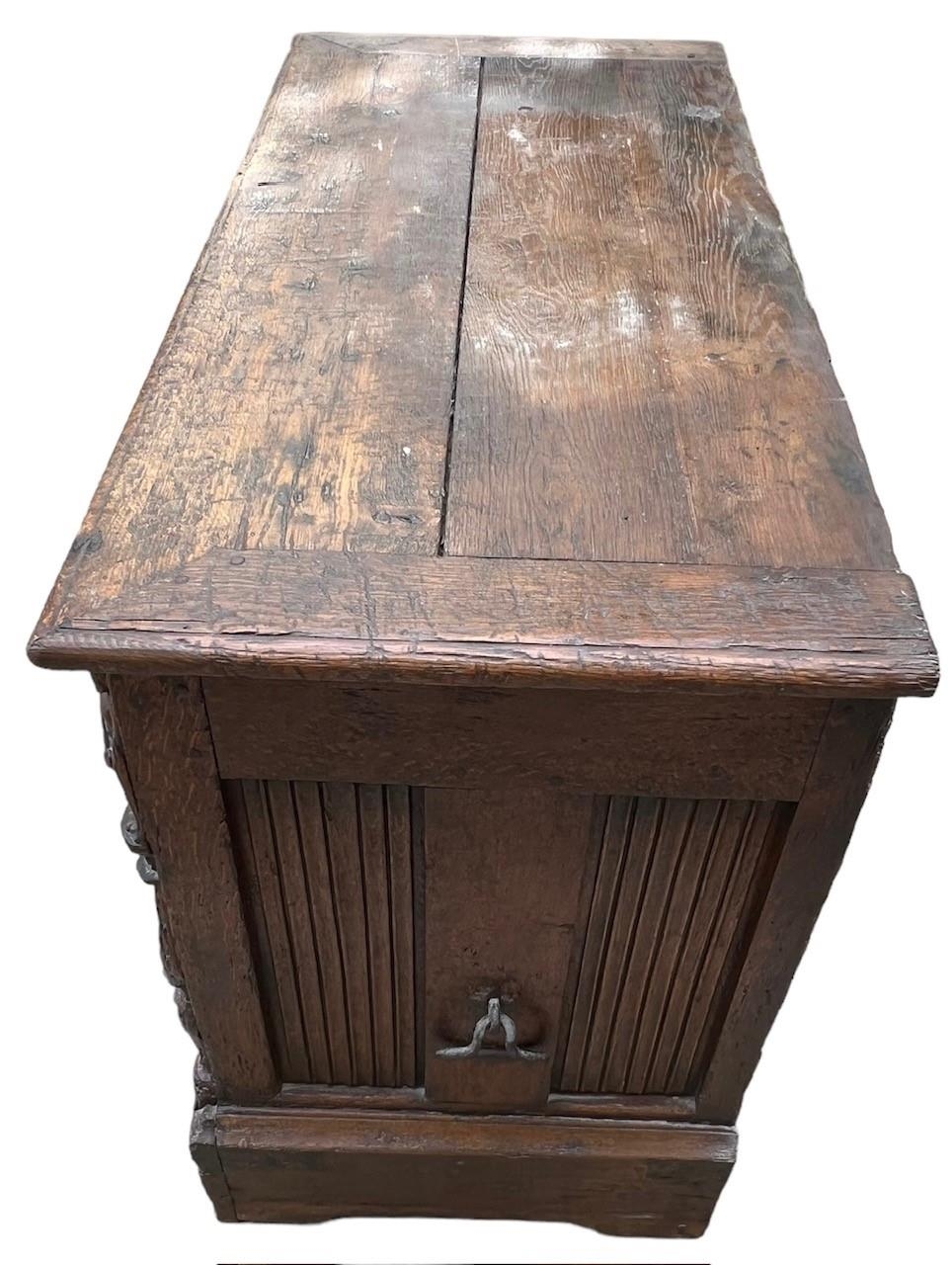 A 16TH CENTURY FRENCH, OAK COFFER with hinged lid above carved freeze decorated with swags and - Image 5 of 13