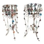 A PAIR OF DECORATIVE WROUGHT IRON AND POLYCHROME FREESTANDING JARDINIÈRES Decorated with scrolling