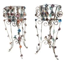 A PAIR OF DECORATIVE WROUGHT IRON AND POLYCHROME FREESTANDING JARDINIÈRES Decorated with scrolling