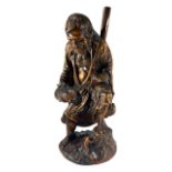 A JAPANESE MEIJI PERIOD CARVED WOODEN FIGURE OF THE DAOIST IMMORTAL, GAMA SENNIN WITH FROG Marked