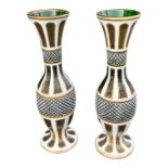 A PAIR OF LATE 19TH/EARLY 20TH CENTURY BOHEMIAN GLASS VASES Having green ground body with white