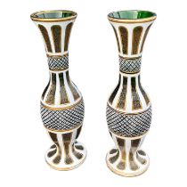A PAIR OF LATE 19TH/EARLY 20TH CENTURY BOHEMIAN GLASS VASES Having green ground body with white