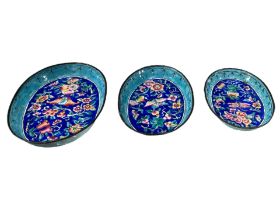 A GRADUATED SET OF THREE 19TH CENTURY CHINESE CANTON ENAMEL OVAL DISHES Decorated with dragonfly,