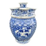 AN UNUSUAL 18TH CENTURY CHINESE PORCELAIN BLUE AND WHITE TULIP VASE The body decorated with four