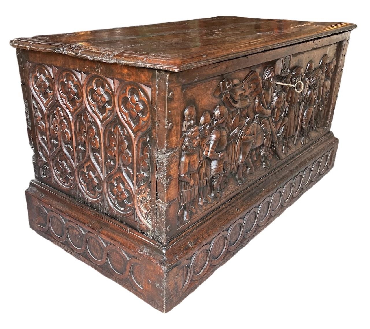 A RARE 15TH CENTURY FRENCH CARVED WALNUT COFFER,With hinge lid above carved panel in relief with a - Image 2 of 4
