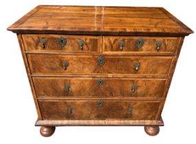 A WILLIAM AND MARY FIGURED WALNUT AND HERRINGBONE INLAY CHEST Two short over three long graduated