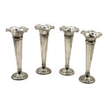 BRITTON, GOULD & CO., FOUR EDWARDIAN SILVER POSY VASES, HALLMARKED BIRMINGHAM, 1905 Having