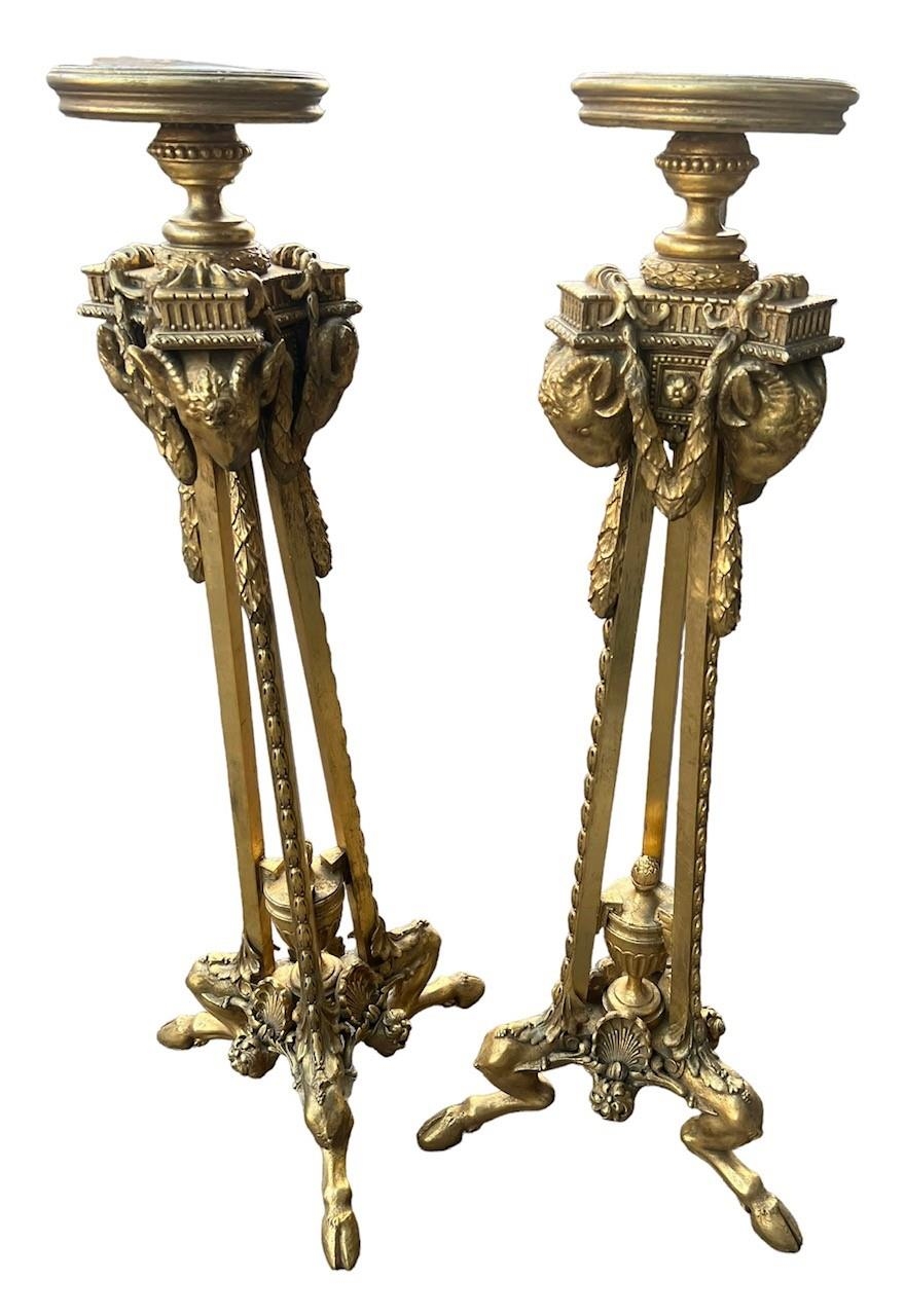 MANNER OF ROBERT ADAM, A PAIR OF 19TH CENTURY NEOCLASSICAL DESIGN CARVED GILTWOOD TORCHERE STANDS