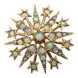 A VINTAGE 9CT GOLD AND OPAL STAR BROOCH Having thirty-three graduated cabochon cut opals, in star