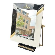 ROLEX, A LARGE ART DECO BRASS AND ENAMEL RECTANGULAR DISPLAY MIRROR Rolex and crown logo