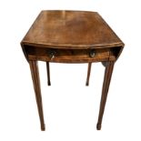 A GEORGE III CARVED MAHOGANY AND INLAID OVAL PEMBROKE TABLE With single drawer raised on square
