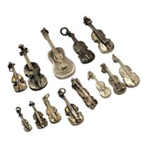 A COLLECTION OF TWELVE VINTAGE CONTINENTAL SILVER MUSICAL INSTRUMENT PENDANTS To include violins,