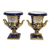 A PAIR OF LATE 20TH CENTURY SEVRES STYLE TWIN HANDLED CAMPANA SHAPED JEWELLED VASES Decorated with